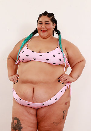 Annabelle Brady stripping from black lingerie and toying her mature pussy